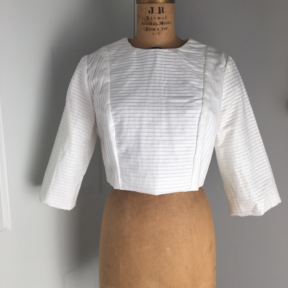 Cropped white blouse.